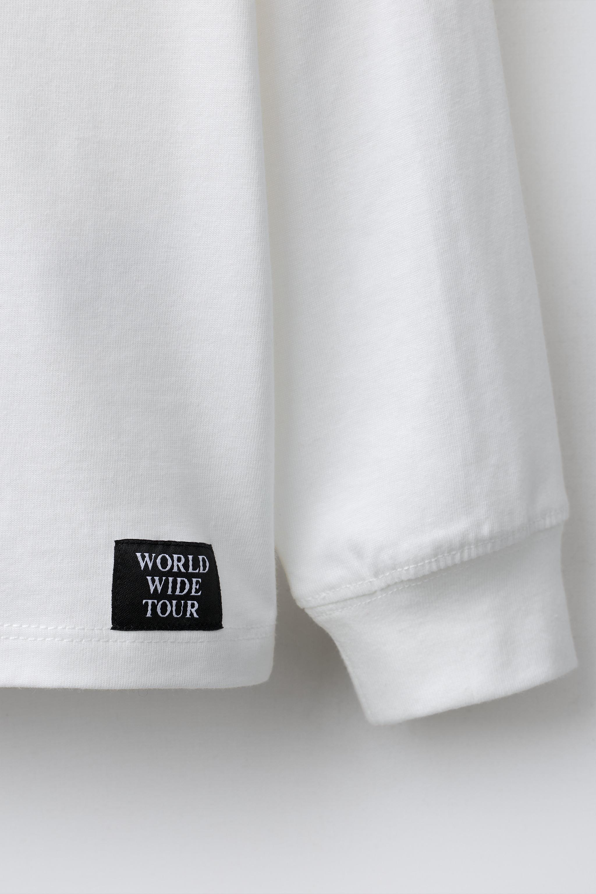 EMBOSSED TEXT T-SHIRT